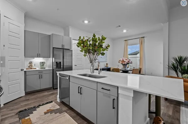 a kitchen with sink and cabinets