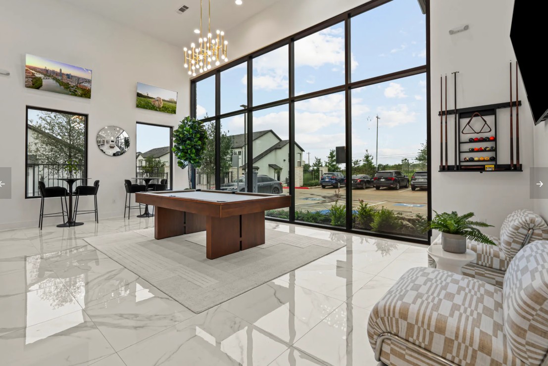 476 Suffield Drive, Unit 771 Buda, TX 78610 - Photo 5 of 5 a living room with large windows