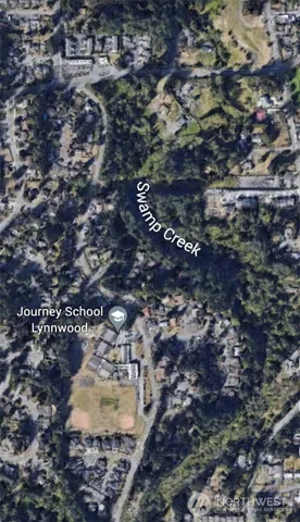 a view of a road from a backyard