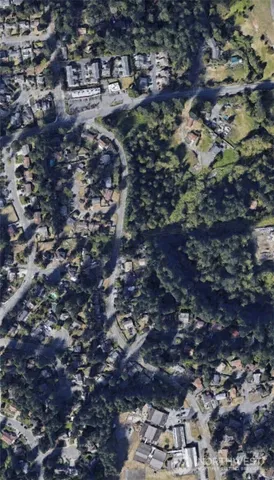 a view of a swimming pool with a yard