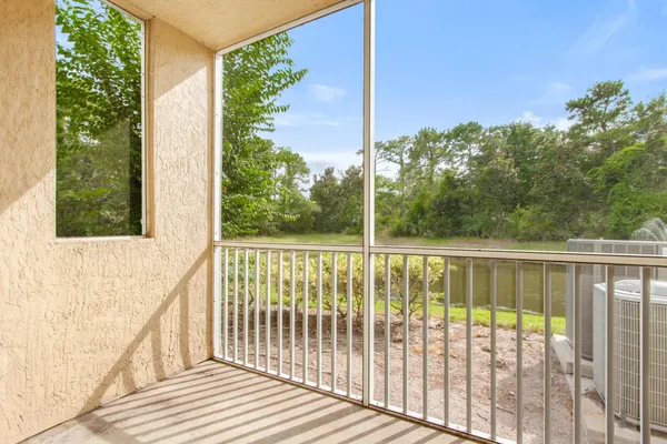 a view of a balcony with wooden floor