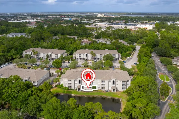 an aerial view of a red and white house