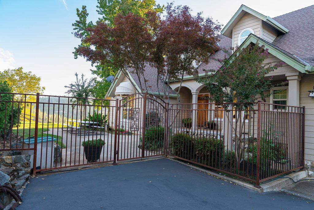10132 Ranch Road Rough and Ready, CA 95975 - Photo 1 of 54 a view of a house with a small yard and plants