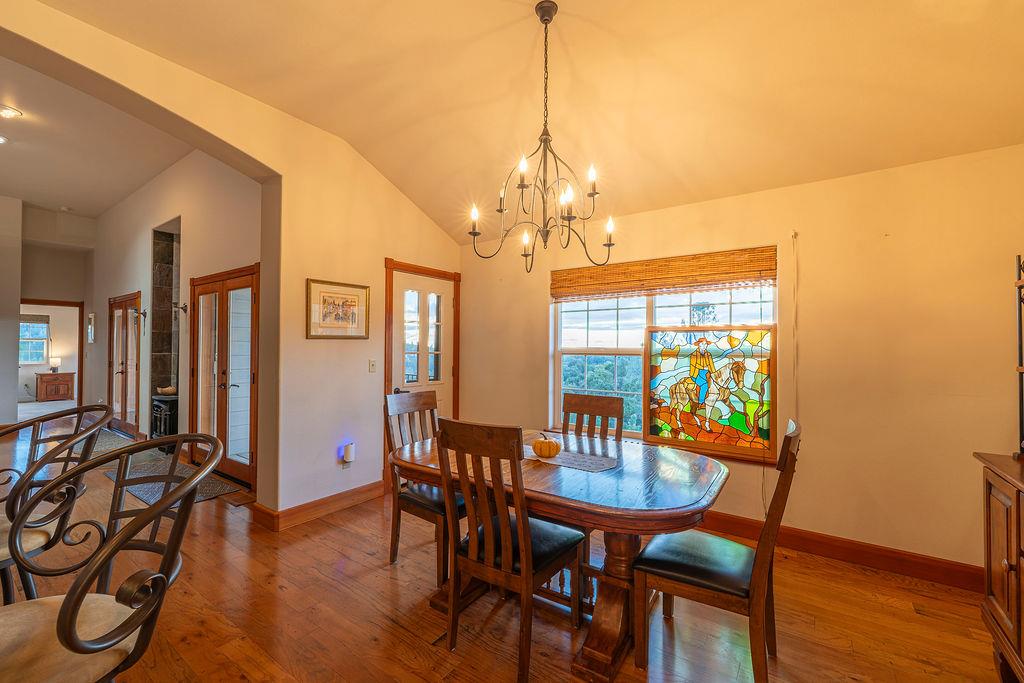 10132 Ranch Road Rough and Ready, CA 95975 - Photo 12 of 54 a view of a dining room with furniture window and wooden floor