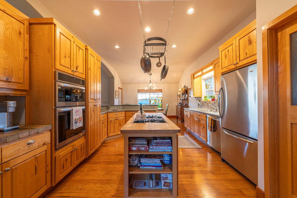 10132 Ranch Road Rough and Ready, CA 95975 - Photo 17 of 54 a kitchen with stainless steel appliances granite countertop a refrigerator a oven and a stove top oven