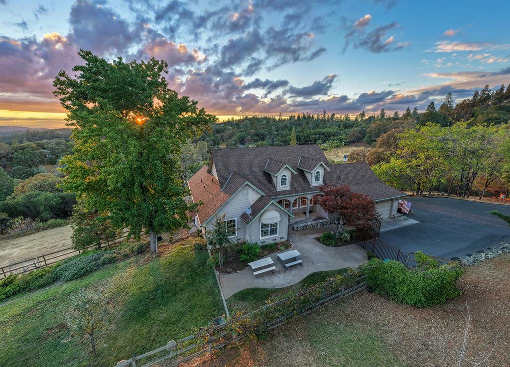 10132 Ranch Road Rough and Ready, CA 95975 - Photo 2 of 54 an aerial view of a house with garden space and street view