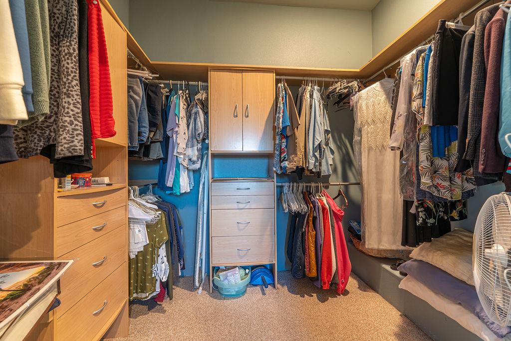 10132 Ranch Road Rough and Ready, CA 95975 - Photo 26 of 54 a view of walk in closet with clothes and shoes