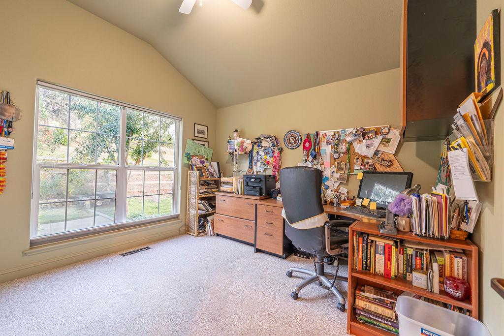 10132 Ranch Road Rough and Ready, CA 95975 - Photo 29 of 54 a bedroom with furniture and a large window