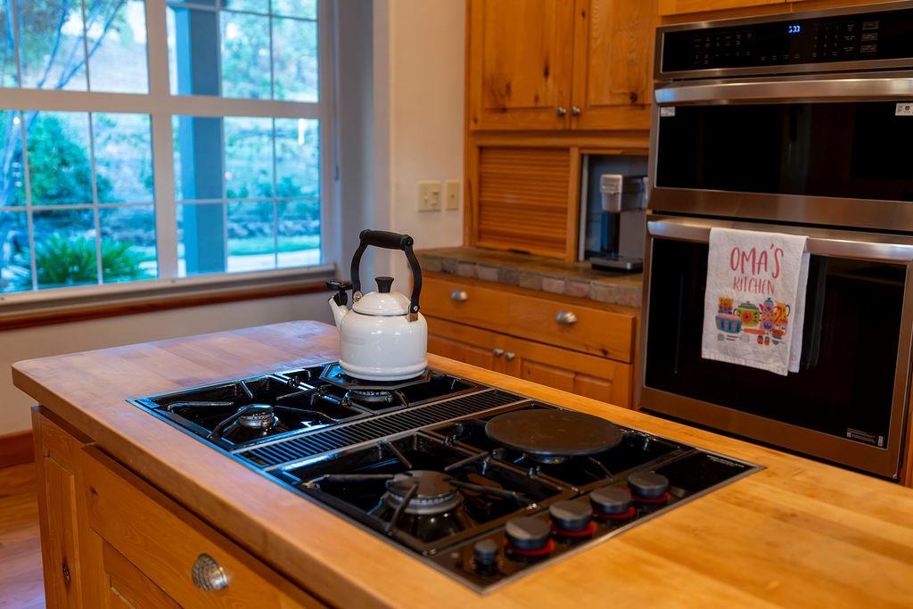 10132 Ranch Road Rough and Ready, CA 95975 - Photo 51 of 54 a stove top oven sitting inside of a kitchen