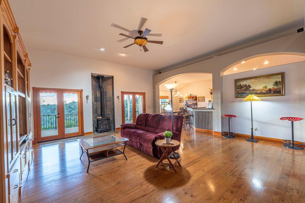 10132 Ranch Road Rough and Ready, CA 95975 - Photo 6 of 54 a living room with furniture pool table and floor to ceiling windows