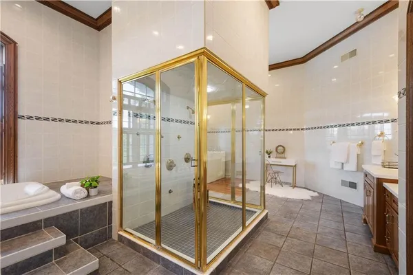 a bathroom with a shower and mirror