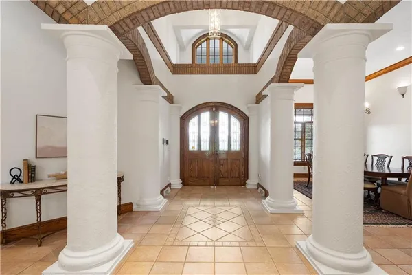 a view of a livingroom with wooden floor and a large window