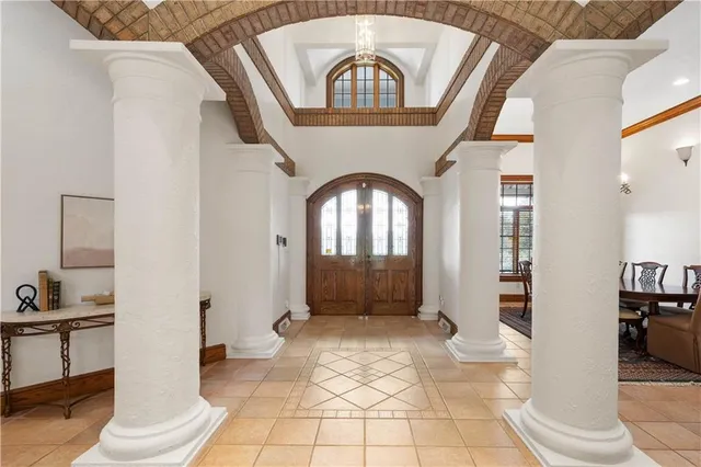 a view of a livingroom with wooden floor and a large window