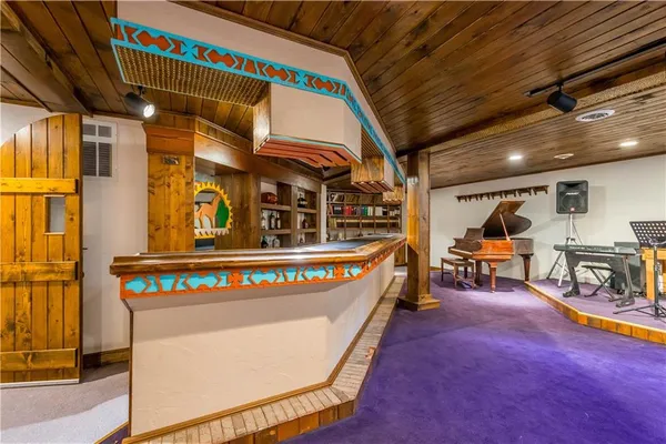 a utility room with multiple dryer and washer