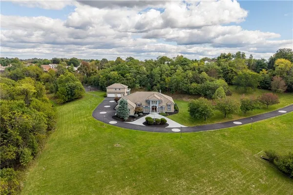 a view of a swimming pool with a yard
