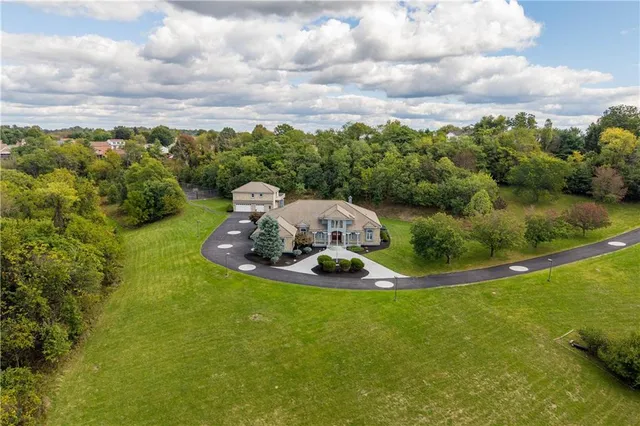 a view of a swimming pool with a yard