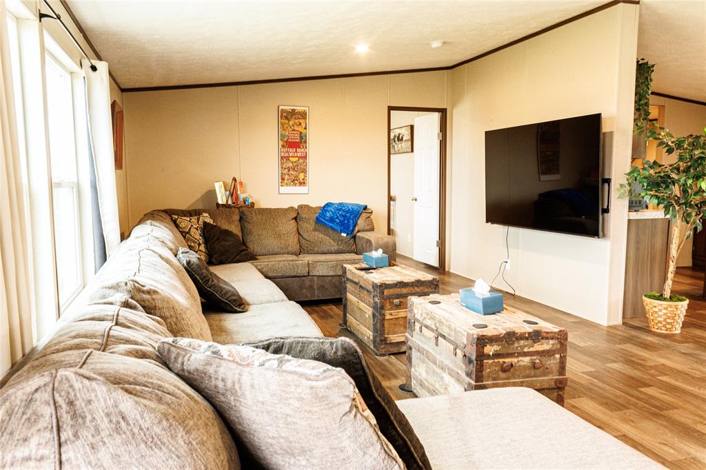 103 County Road Comanche, TX 76442 - Photo 26 of 37 a living room with furniture and a flat screen tv