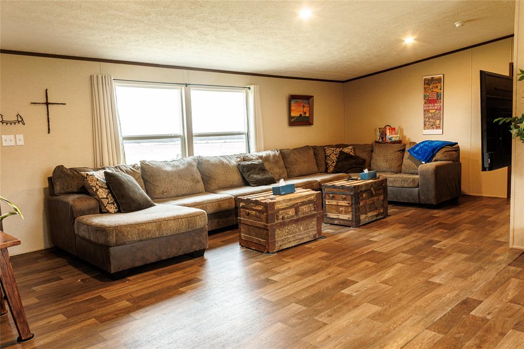 103 County Road Comanche, TX 76442 - Photo 27 of 37 a living room with furniture and a large window