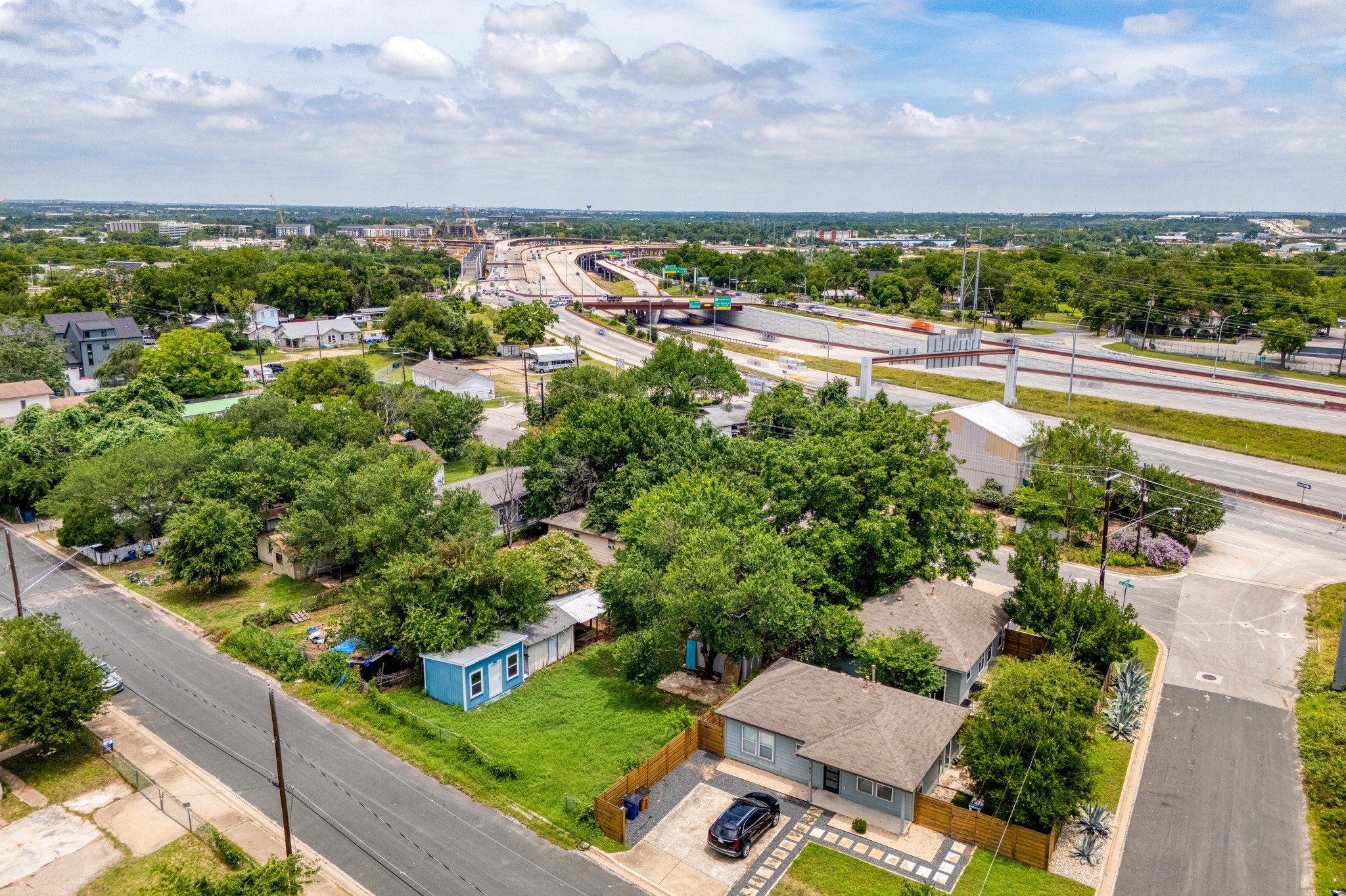 6409 Del Monte Road Austin, TX 78741 - Photo 13 of 15 An aerial perspective reveals a residential neighborhood bordering a bustling freeway system.
