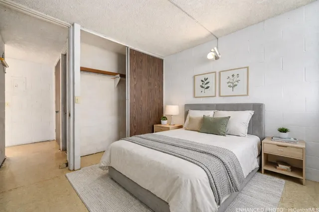 a bedroom with a bed and a walk in closet