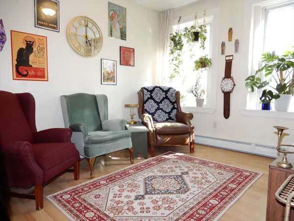 a living room with furniture and a table