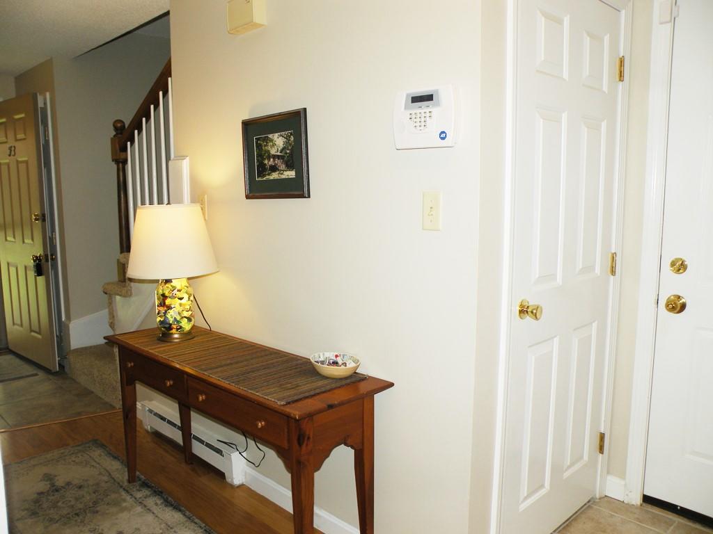 3 Fieldstone Court, Unit 3 Portland, ME 04103 - Photo 17 of 39 Side hall to attached garage