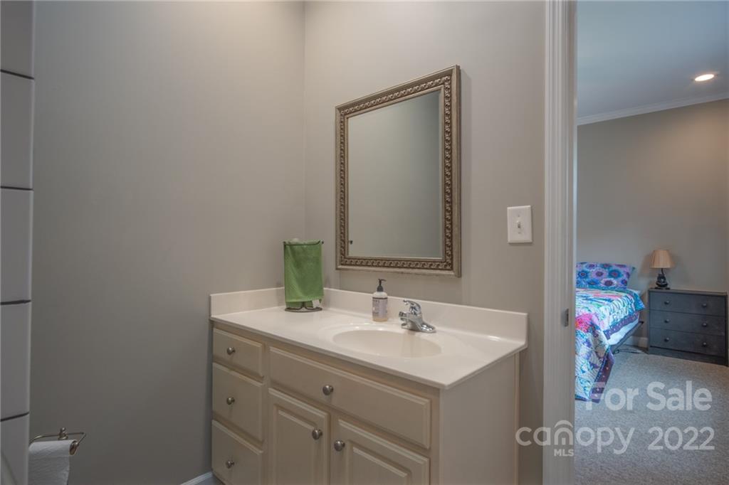 6925 Medlin Road Monroe, NC 28112 - Photo 18 of 41 a bathroom with a sink toilet and a mirror