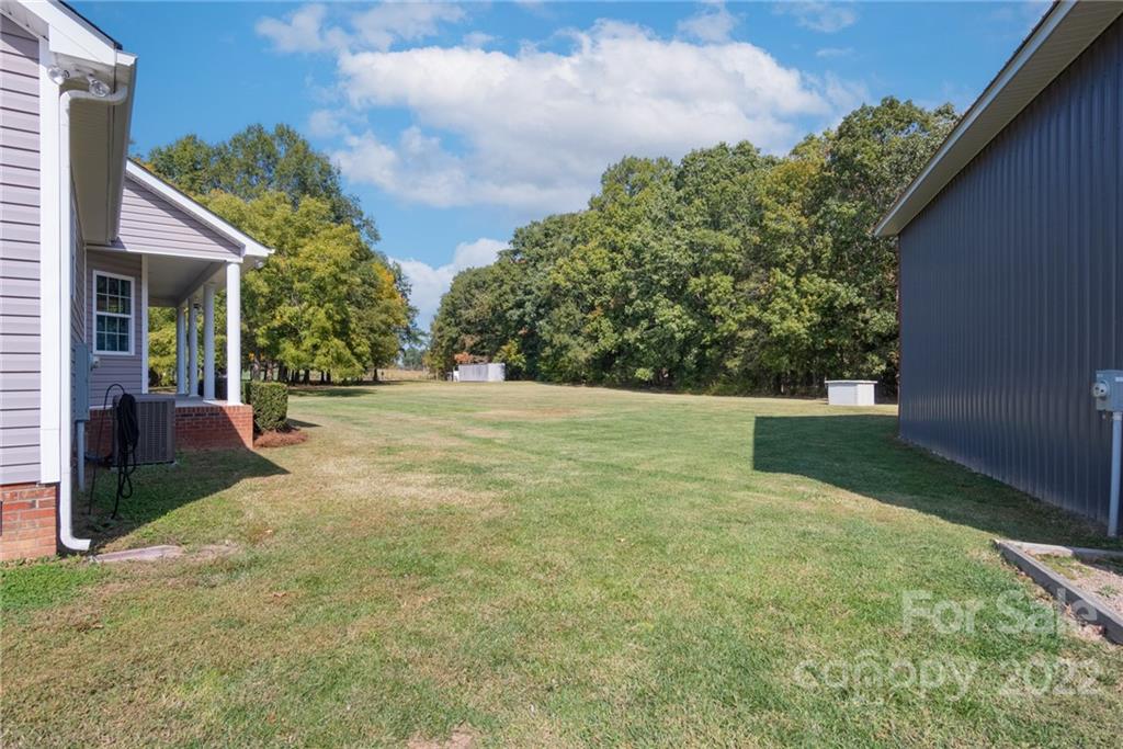 6925 Medlin Road Monroe, NC 28112 - Photo 22 of 41 a view of a backyard
