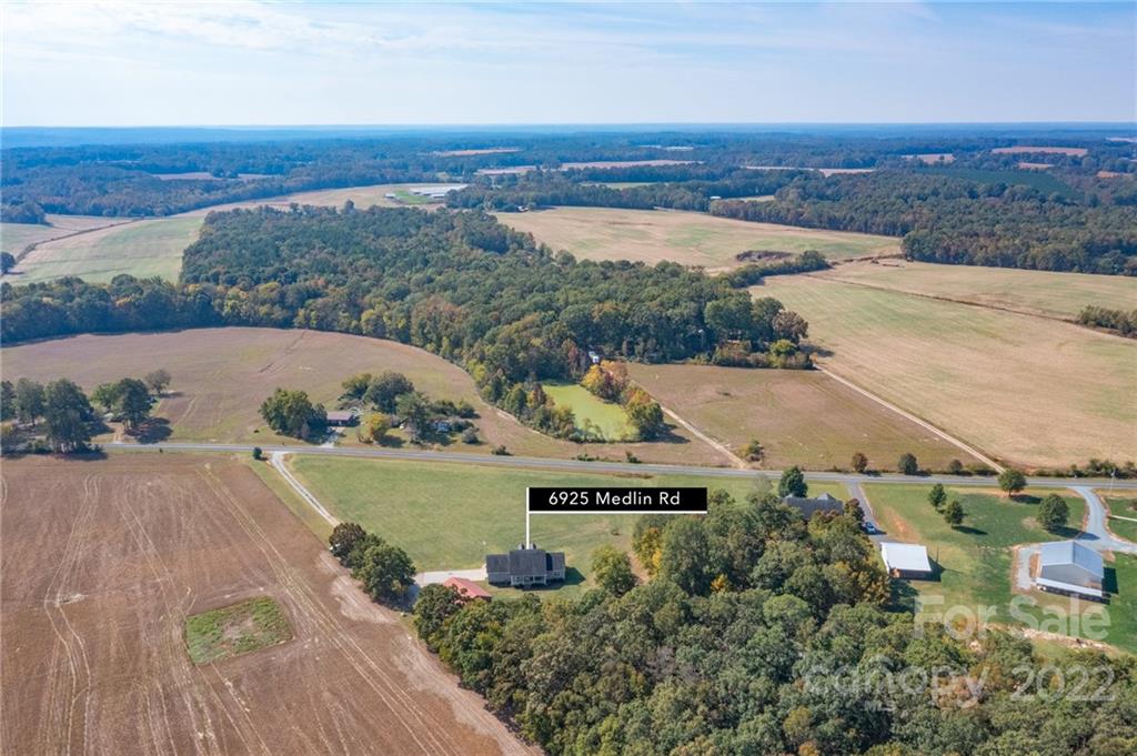 6925 Medlin Road Monroe, NC 28112 - Photo 25 of 41 an aerial view of a house and outdoor space