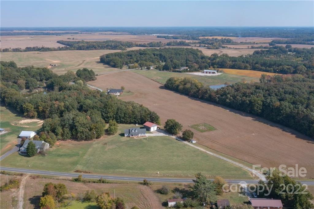 6925 Medlin Road Monroe, NC 28112 - Photo 27 of 41 an aerial view of a houses with outdoor space
