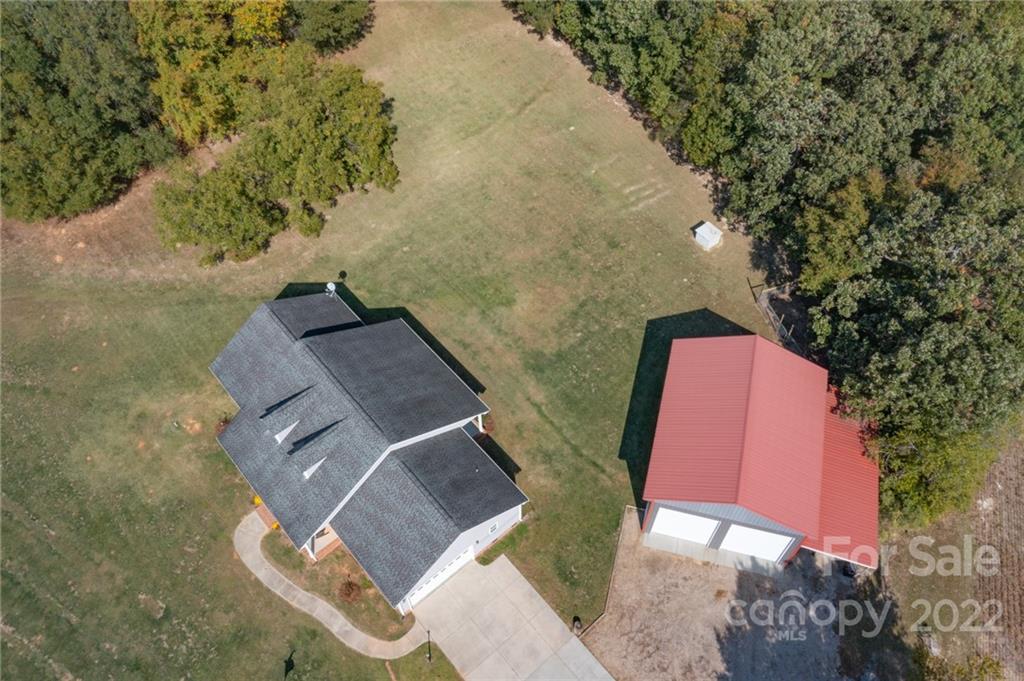 6925 Medlin Road Monroe, NC 28112 - Photo 28 of 41 an aerial view of a house with a yard
