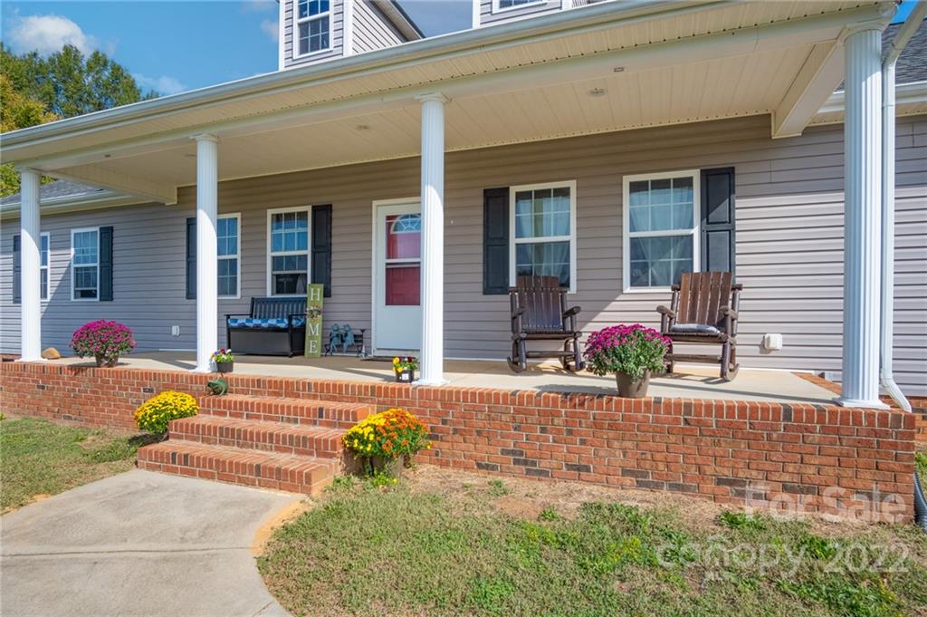6925 Medlin Road Monroe, NC 28112 - Photo 3 of 41 a front view of a house with patio