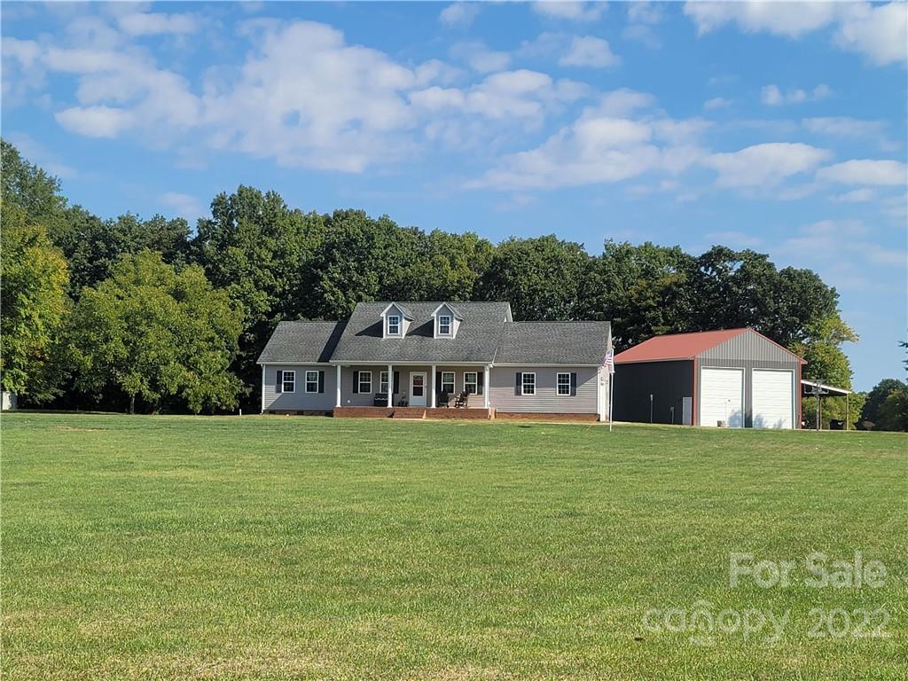 6925 Medlin Road Monroe, NC 28112 - Photo 35 of 41 a view of a house with a yard