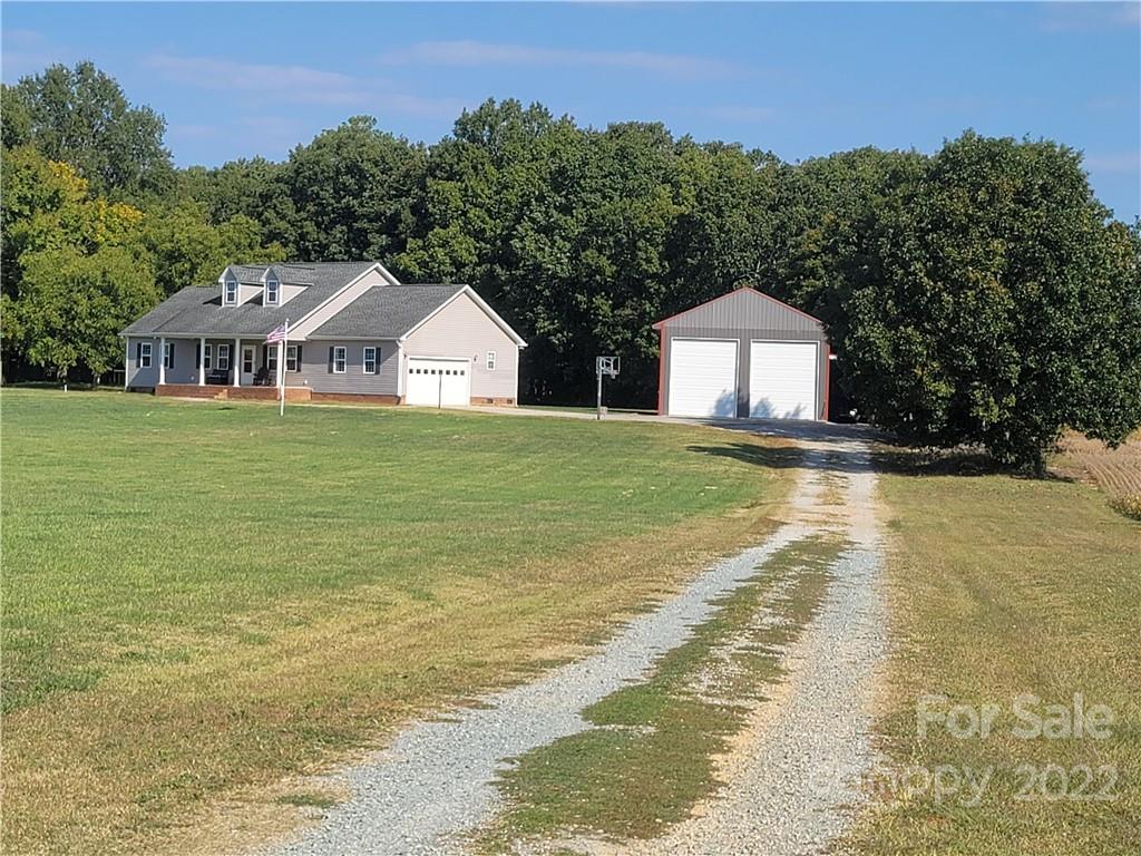 6925 Medlin Road Monroe, NC 28112 - Photo 38 of 41 a front view of a house with a yard