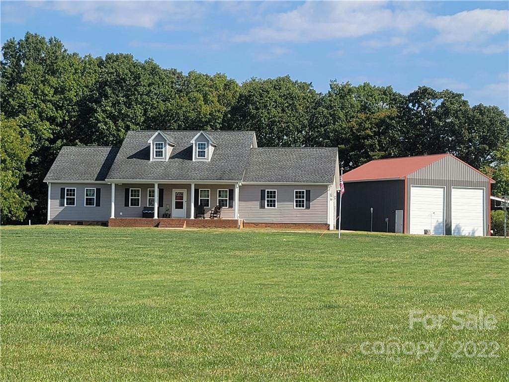 6925 Medlin Road Monroe, NC 28112 - Photo 41 of 41 a front view of a house with a garden