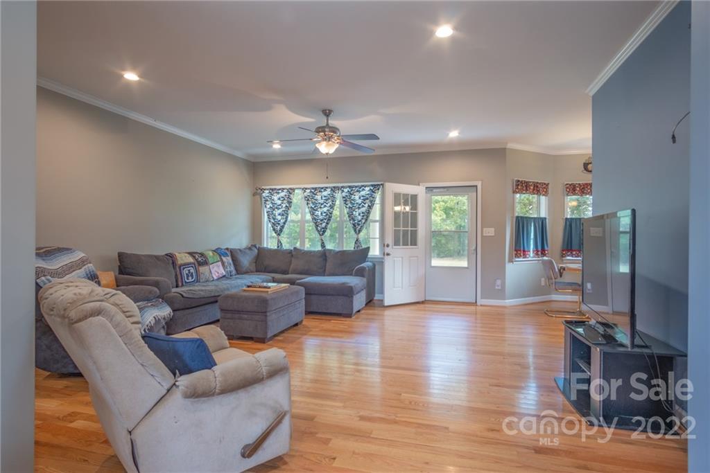 6925 Medlin Road Monroe, NC 28112 - Photo 7 of 41 a living room with furniture and a large window