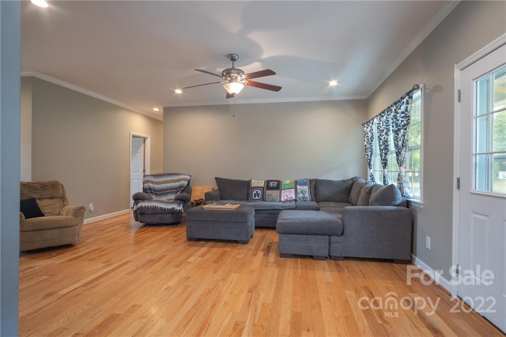 6925 Medlin Road Monroe, NC 28112 - Photo 9 of 41 a living room with furniture and a large window