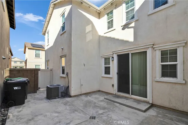 a view of a brick house with many windows