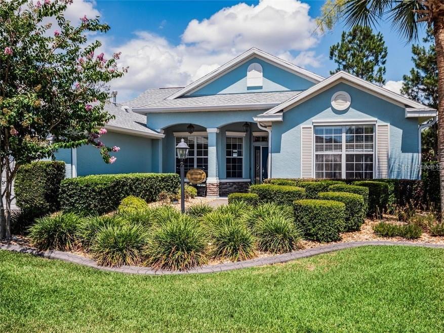 8908 Southwest 84th Circle Ocala, FL 34481 - Photo 1 of 24 a front view of a house with a yard
