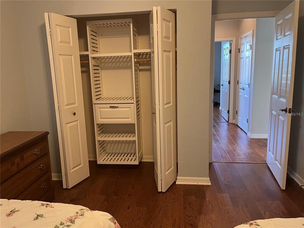 8908 Southwest 84th Circle Ocala, FL 34481 - Photo 20 of 24 a view of a hallway with wooden floor and cabinet