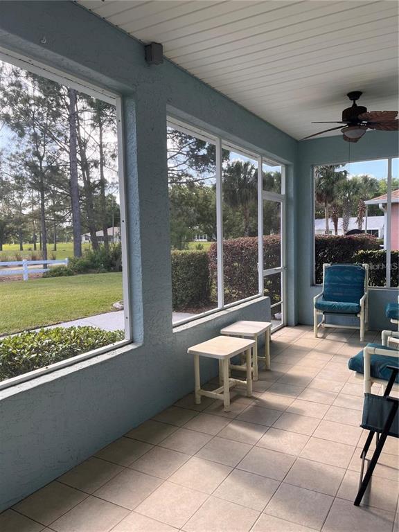 8908 Southwest 84th Circle Ocala, FL 34481 - Photo 22 of 24 a building outdoor space with patio furniture and garden view