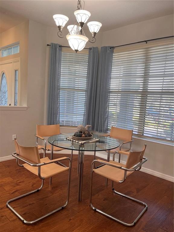 8908 Southwest 84th Circle Ocala, FL 34481 - Photo 3 of 24 a room with table chairs and windows