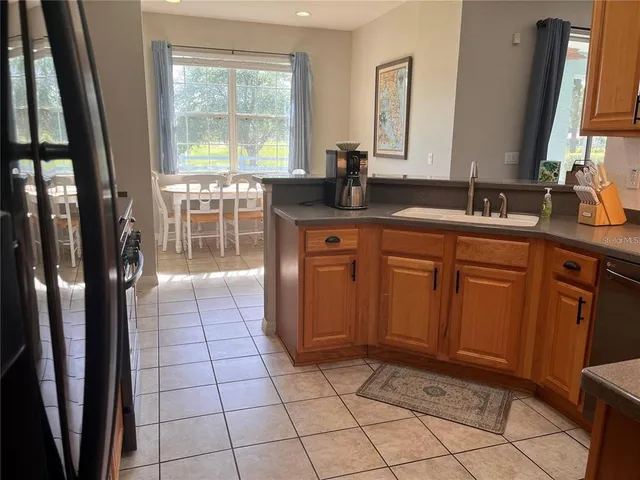a spacious bathroom with a mirror a sink and a shower