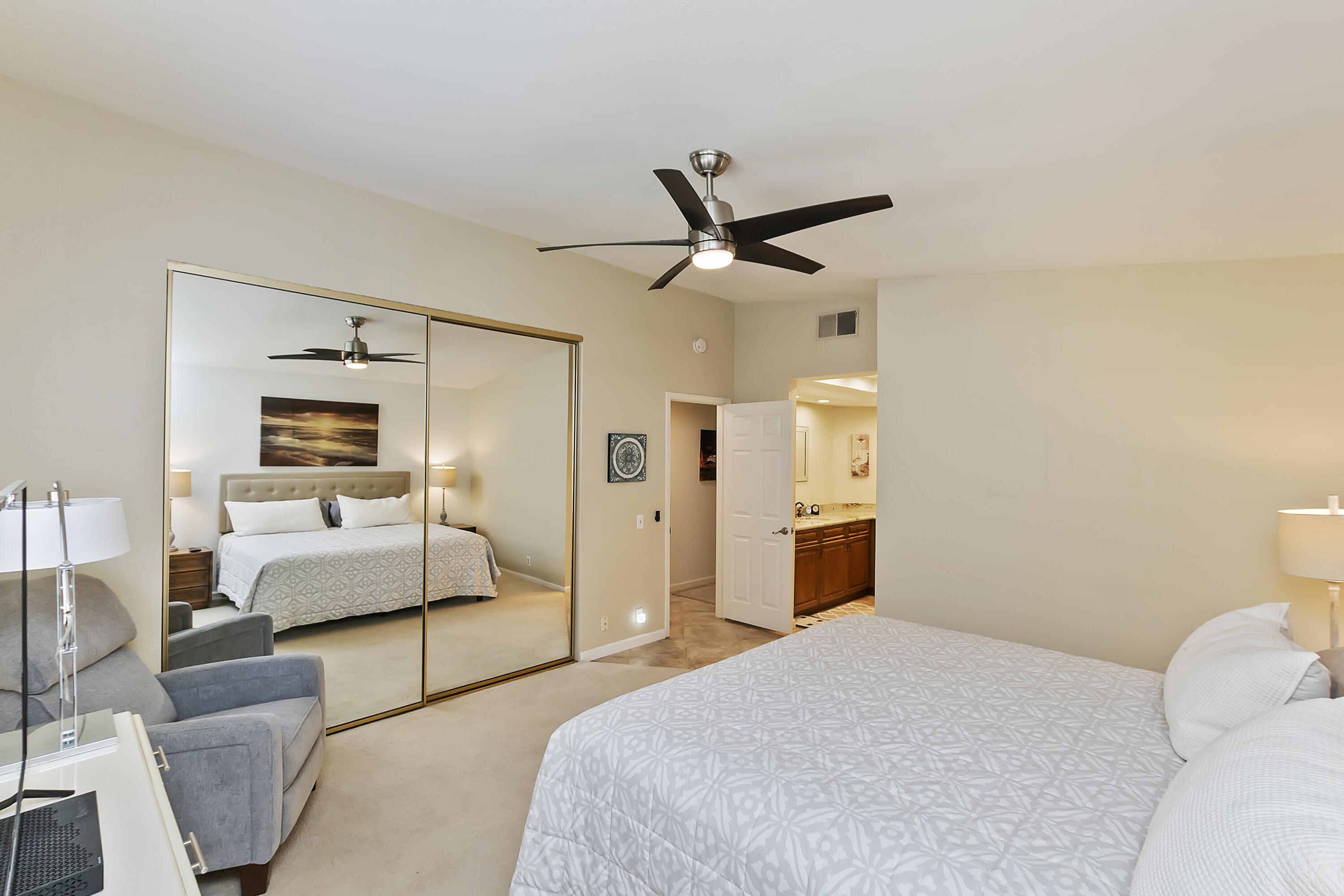 6 Maximo Way Palm Desert, CA 92260 - Photo 14 of 48 a bedroom with a bed and a mirror