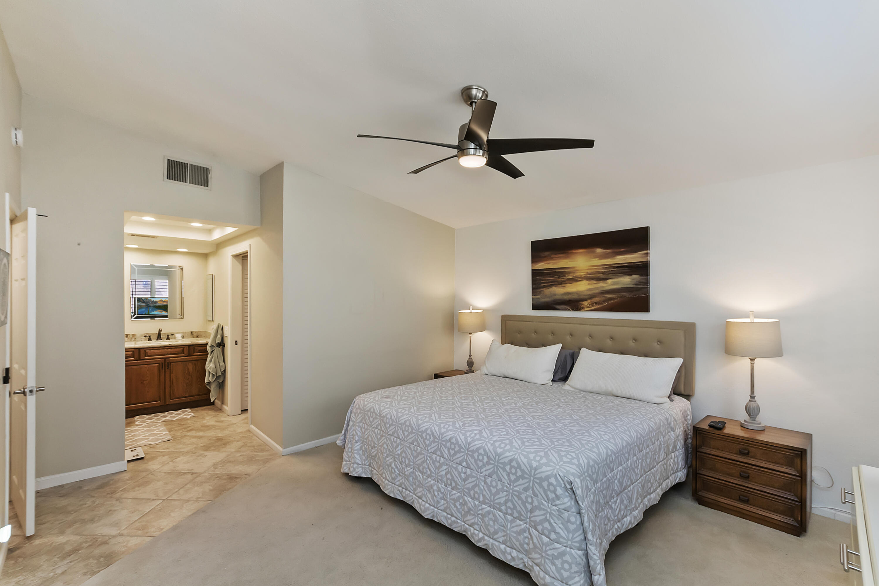 6 Maximo Way Palm Desert, CA 92260 - Photo 15 of 48 a bedroom with a bed and a tv