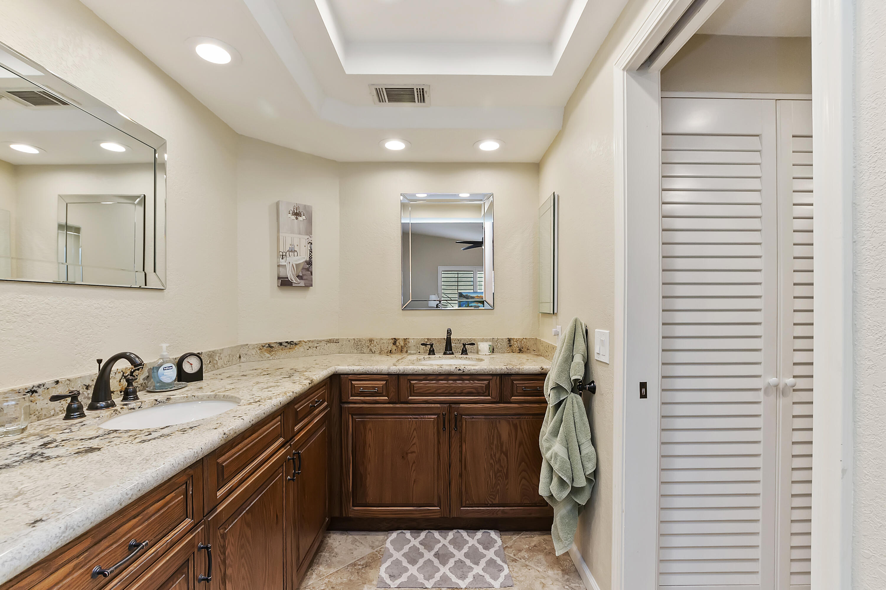 6 Maximo Way Palm Desert, CA 92260 - Photo 16 of 48 a bathroom with a sink and a mirror