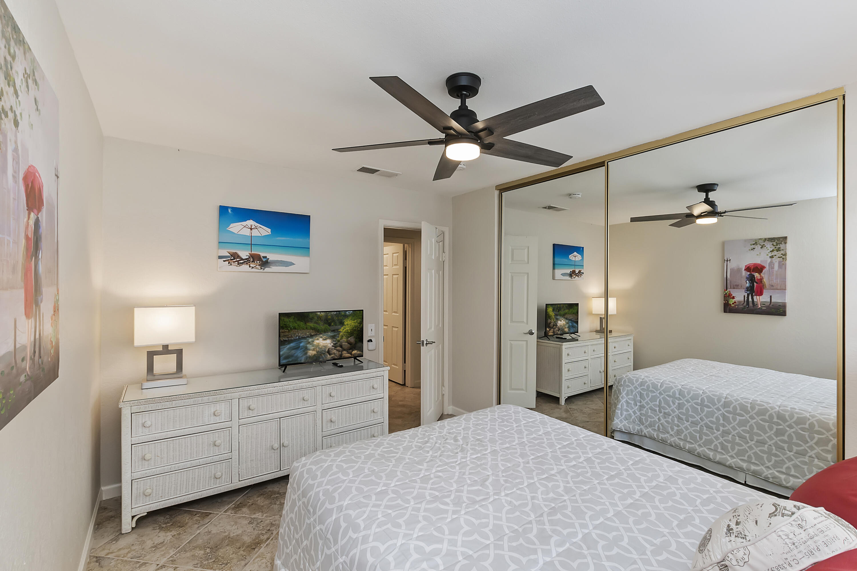 6 Maximo Way Palm Desert, CA 92260 - Photo 21 of 48 a bedroom with a bed and a chandelier