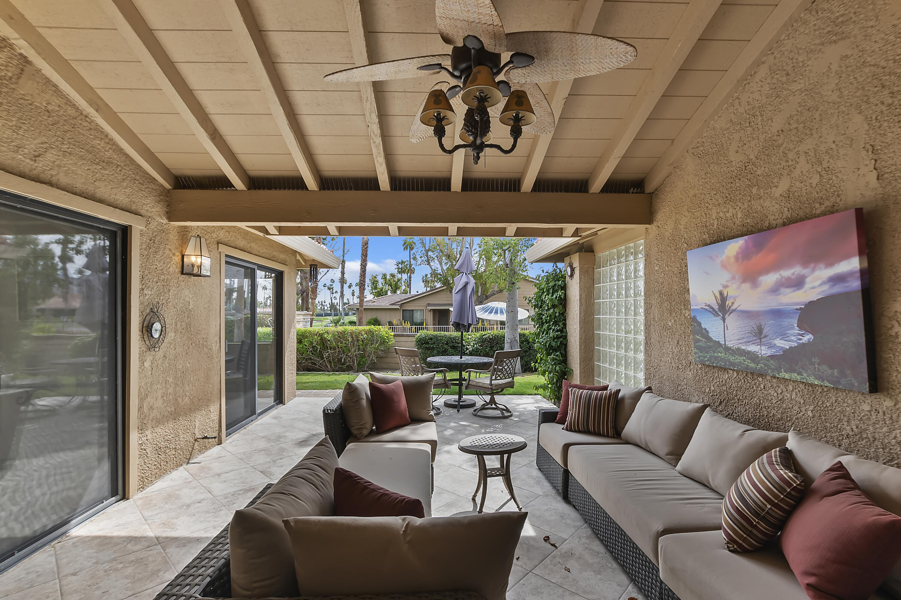 6 Maximo Way Palm Desert, CA 92260 - Photo 24 of 48 a living room with furniture and a large window