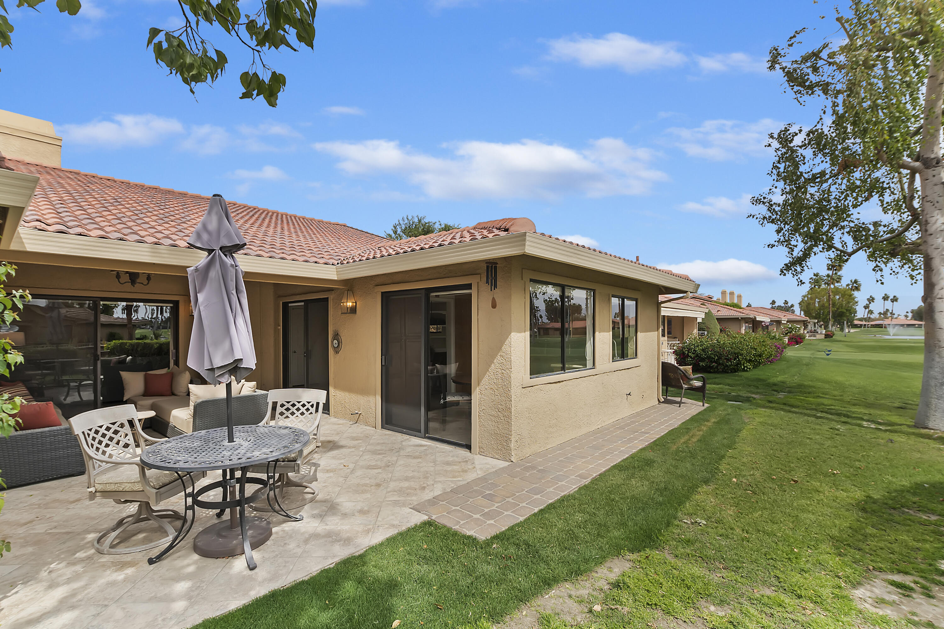 6 Maximo Way Palm Desert, CA 92260 - Photo 27 of 48 a view of a house with backyard sitting area and garden