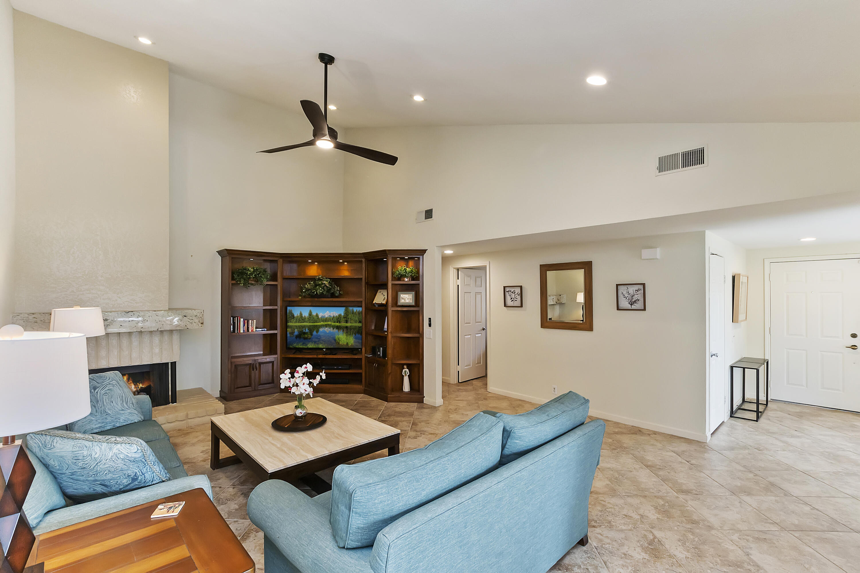6 Maximo Way Palm Desert, CA 92260 - Photo 3 of 48 a living room with furniture and a flat screen tv